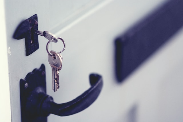 First Time Home Buyer - Close up image of keys in a house front door